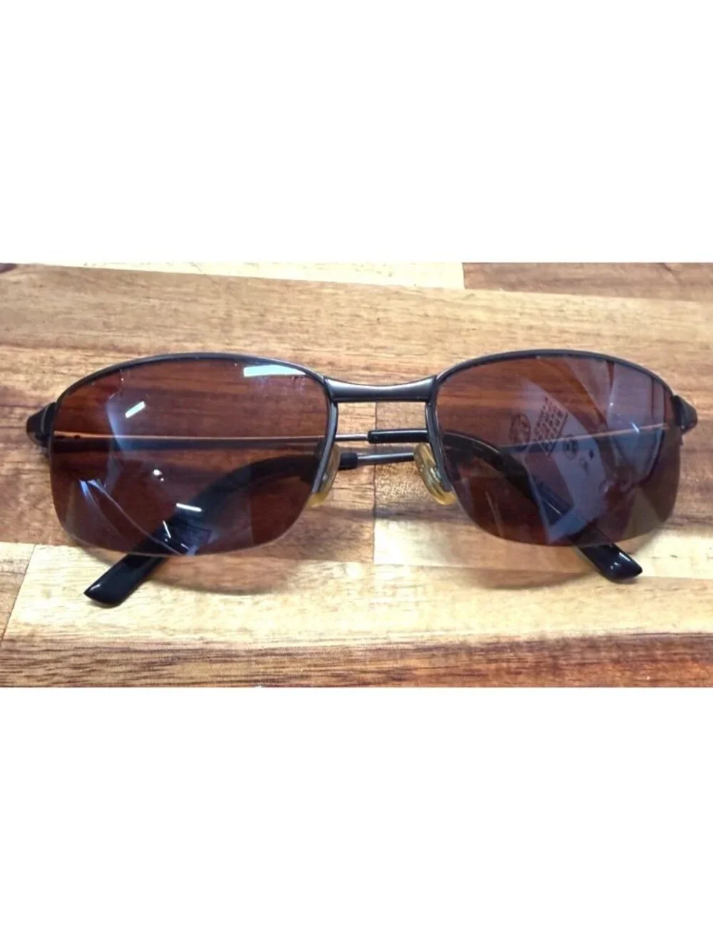 Nice pair of sunglasses with hard embossed case, cleaning cloth